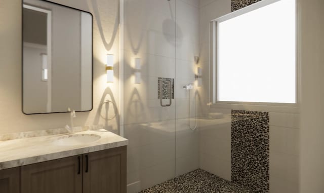 bathroom with vanity and a tile shower