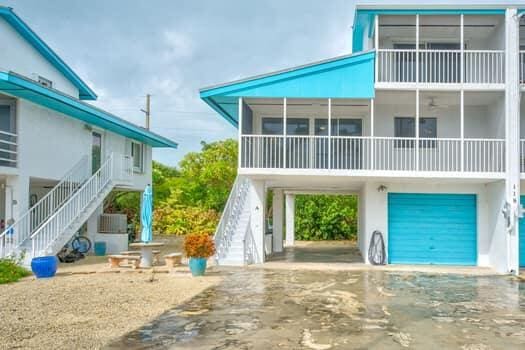 back of property with a garage