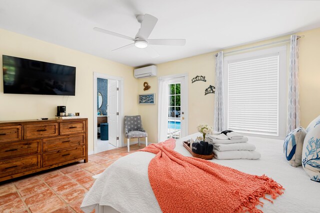 bedroom featuring ceiling fan, light tile patterned floors, access to outside, and an AC wall unit