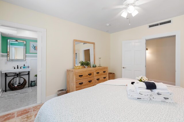 tiled bedroom with ceiling fan