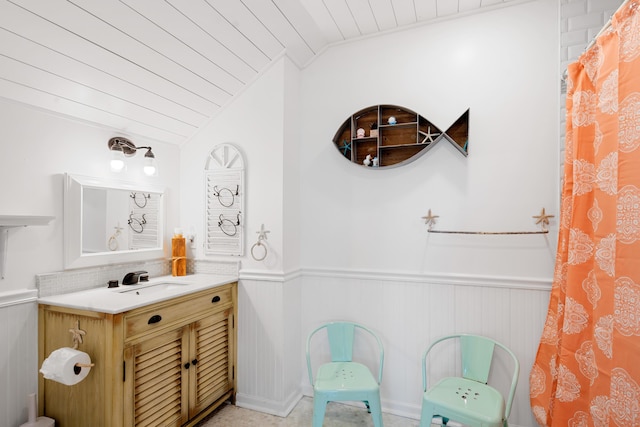 bathroom featuring vanity, lofted ceiling, and wooden ceiling