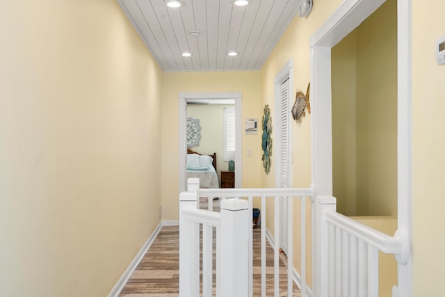 hallway with light hardwood / wood-style flooring