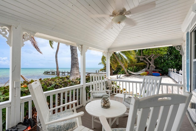 deck featuring a water view and ceiling fan