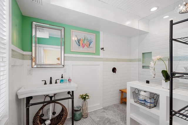 bathroom with tile walls