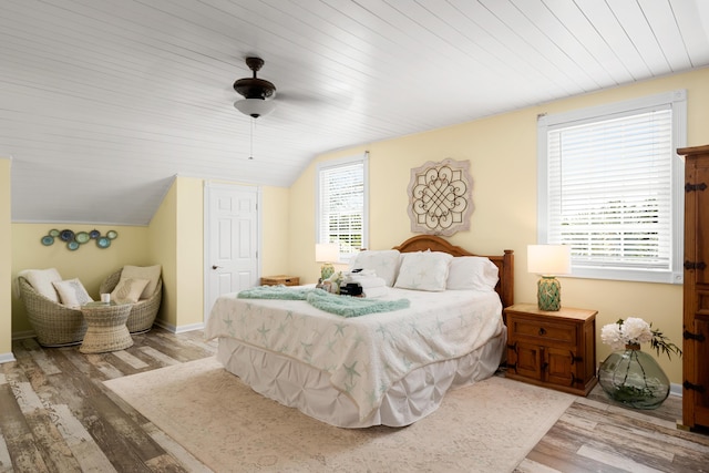 bedroom featuring vaulted ceiling, ceiling fan, wood ceiling, and light hardwood / wood-style floors