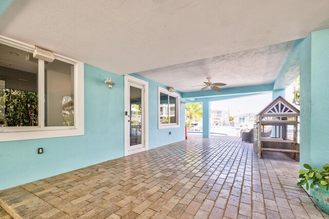 view of patio featuring ceiling fan