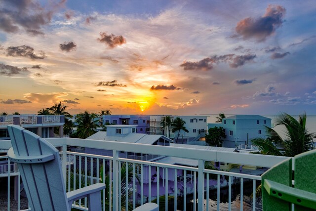 view of balcony at dusk