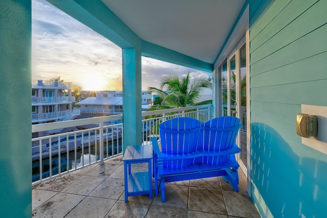 view of balcony at dusk