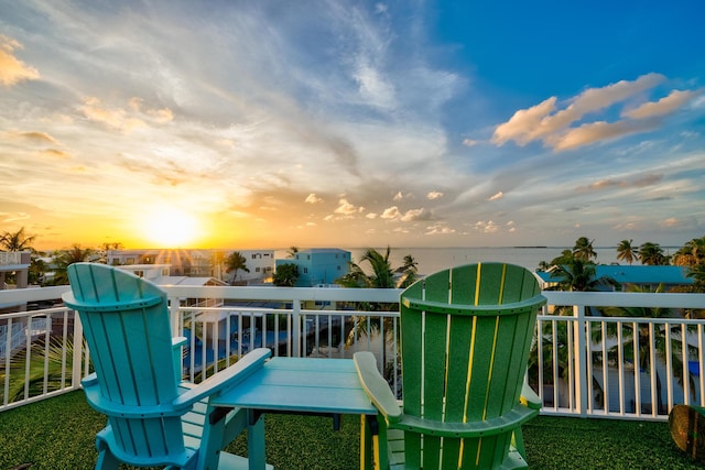 balcony at dusk with a water view