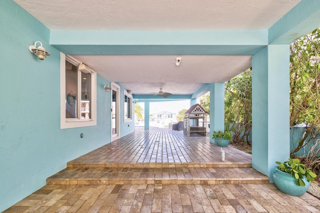 view of patio featuring ceiling fan