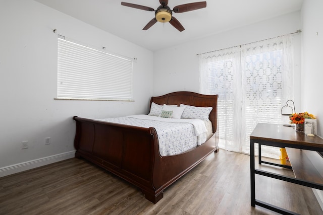 bedroom with dark wood-type flooring and ceiling fan