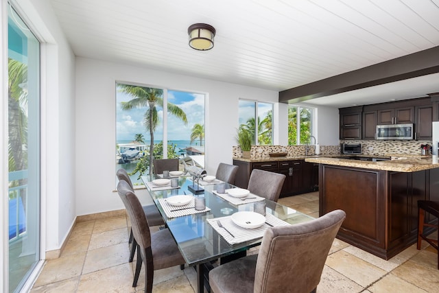 sunroom with a water view