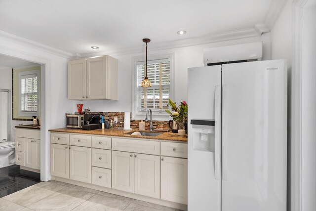71 N Bay Harbor Dr, Key Largo, FL 33037 - kitchen featuring white fridge with ice dispenser, crown molding, pendant lighting, recessed lighting, and decorative backsplash