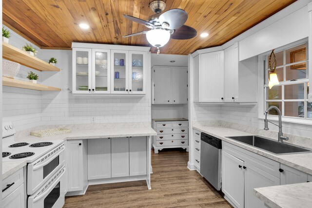 71 N Bay Harbor Dr, Key Largo, FL 33037 - kitchen with electric range, stainless steel dishwasher, wooden ceiling, white cabinetry, and backsplash