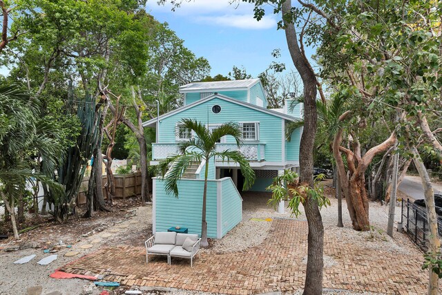 71 N Bay Harbor Dr, Key Largo, FL 33037 - view of front facade with a metal roof