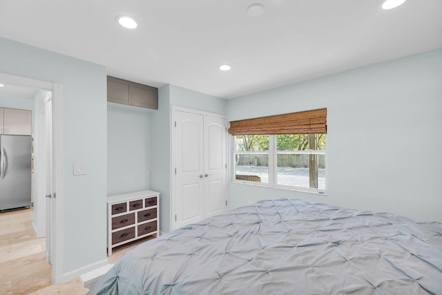 131 Ocean Ln, Islamorada, FL 33036 - bedroom featuring stainless steel fridge, baseboards, a closet, and recessed lighting