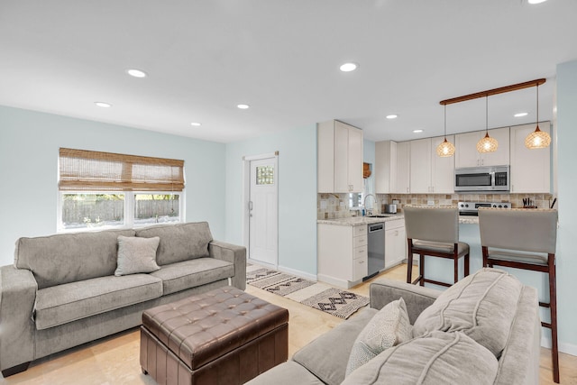 131 Ocean Ln, Islamorada, FL 33036 - living room with recessed lighting and light wood-style flooring