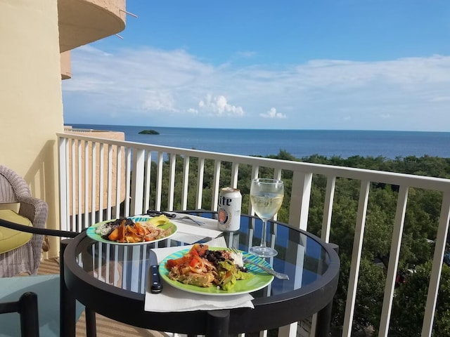 balcony featuring a water view