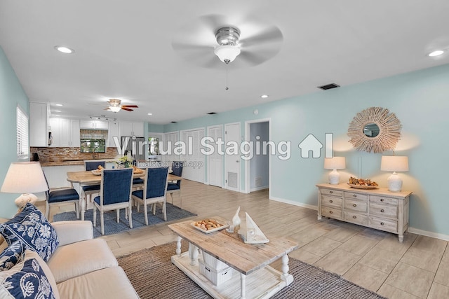 living room featuring ceiling fan