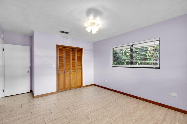 unfurnished bedroom featuring a closet