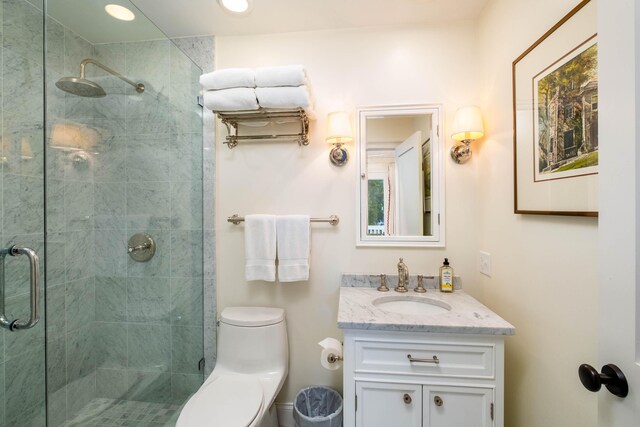 81250 Overseas Hwy Unit 5, Islamorada, FL 33036 - bathroom featuring vanity, toilet, and a shower with shower door