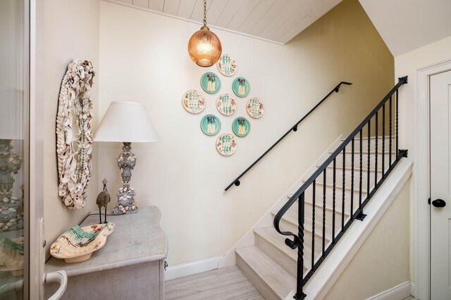 81250 Overseas Hwy Unit 5, Islamorada, FL 33036 - stairs featuring hardwood / wood-style floors