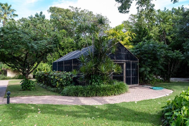 81250 Overseas Hwy Unit 5, Islamorada, FL 33036 - view of outdoor structure featuring a lawn