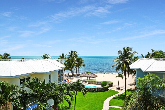 property view of water featuring a gazebo and a beach view