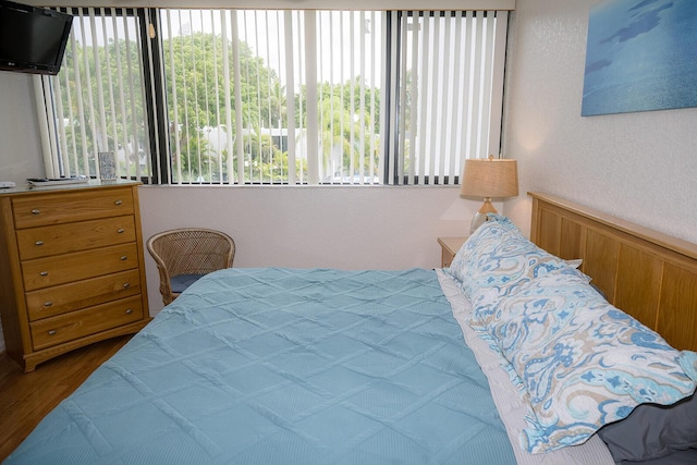 104350 Overseas Hwy Unit B205, Key Largo, FL 33037 - bedroom with multiple windows and wood finished floors