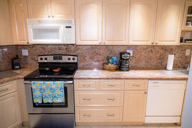 104350 Overseas Hwy Unit B205, Key Largo, FL 33037 - kitchen with white appliances, backsplash, light stone counters, and light tile patterned flooring