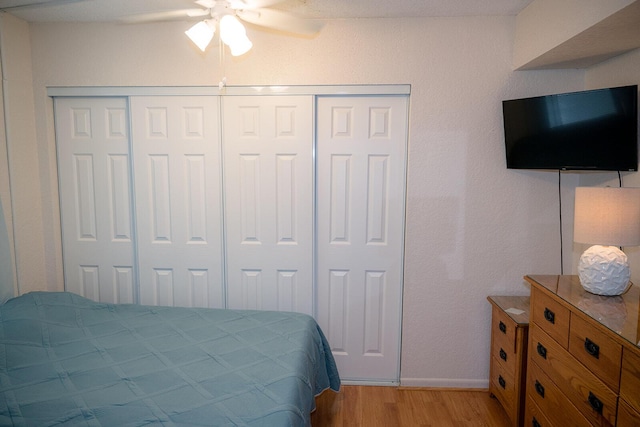 104350 Overseas Hwy Unit B205, Key Largo, FL 33037 - bedroom with light wood-type flooring, a closet, and a ceiling fan
