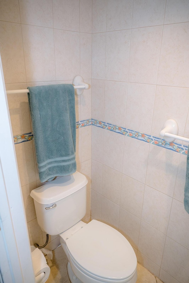 104350 Overseas Hwy Unit B205, Key Largo, FL 33037 - bathroom featuring toilet and tile walls