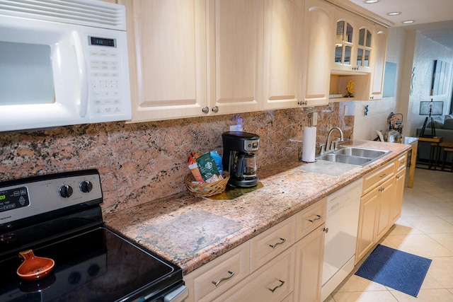 104350 Overseas Hwy Unit B205, Key Largo, FL 33037 - kitchen featuring white appliances, decorative backsplash, light tile patterned floors, glass insert cabinets, and open shelves