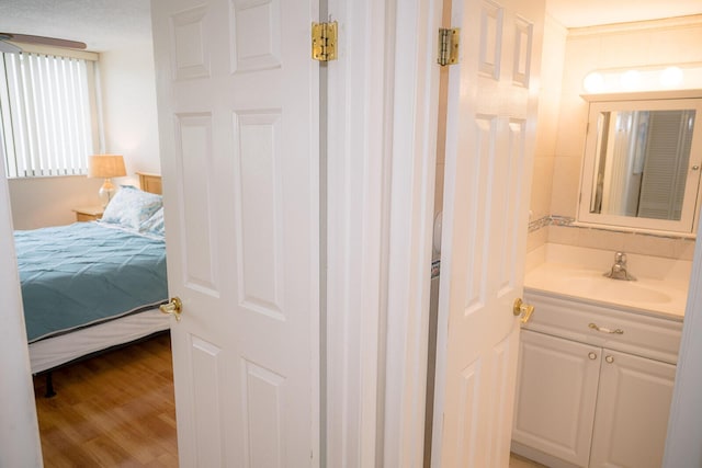 104350 Overseas Hwy Unit B205, Key Largo, FL 33037 - bathroom with vanity, ensuite bathroom, and wood finished floors