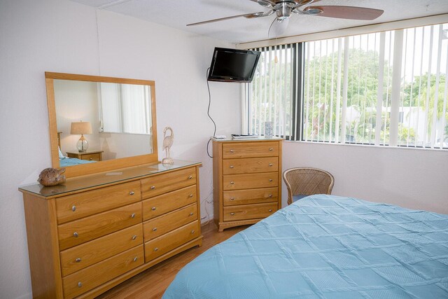 104350 Overseas Hwy Unit B205, Key Largo, FL 33037 - bedroom with wood finished floors and ceiling fan