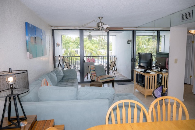 104350 Overseas Hwy Unit B205, Key Largo, FL 33037 - living room with floor to ceiling windows, healthy amount of natural light, a ceiling fan, a textured ceiling, and a textured wall