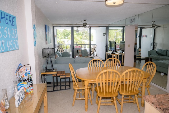 104350 Overseas Hwy Unit B205, Key Largo, FL 33037 - dining area with ceiling fan, a textured wall, and light tile patterned flooring