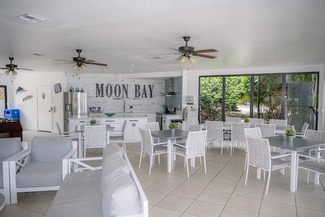 104350 Overseas Hwy Unit B205, Key Largo, FL 33037 - dining area featuring ceiling fan and light tile patterned floors