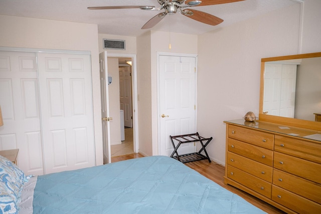 104350 Overseas Hwy Unit B205, Key Largo, FL 33037 - bedroom with light wood-style flooring and a ceiling fan