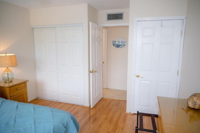104350 Overseas Hwy Unit B205, Key Largo, FL 33037 - bedroom with light wood-type flooring and a closet