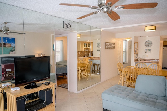 104350 Overseas Hwy Unit B205, Key Largo, FL 33037 - living room with ceiling fan, tile patterned flooring, and a textured ceiling