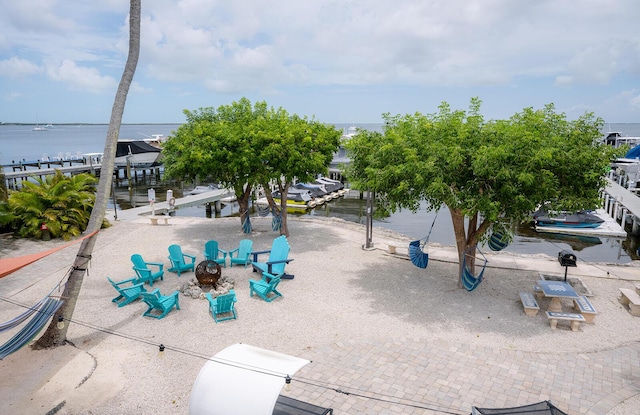 104350 Overseas Hwy Unit B205, Key Largo, FL 33037 - view of property's community featuring a water view, a boat dock, a fire pit, and boat lift