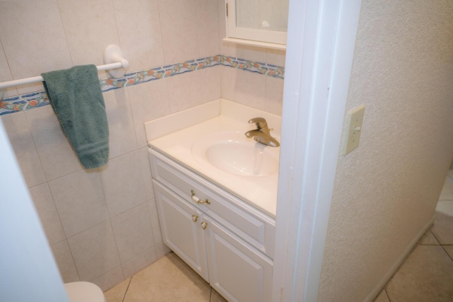 104350 Overseas Hwy Unit B205, Key Largo, FL 33037 - bathroom featuring vanity, tile walls, and tile patterned floors