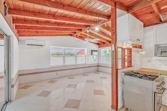 140 Gardenia St, Tavernier, FL 33070 - kitchen with wooden ceiling, double oven range, white cabinets, an AC wall unit, and a ceiling fan
