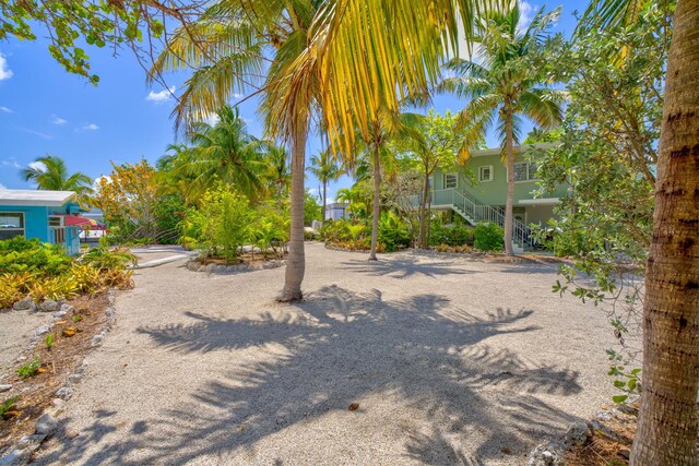 140 Gardenia St, Tavernier, FL 33070 - view of yard with stairs