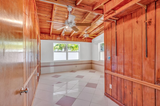 140 Gardenia St, Tavernier, FL 33070 - empty room with wood ceiling, light tile patterned floors, and ceiling fan
