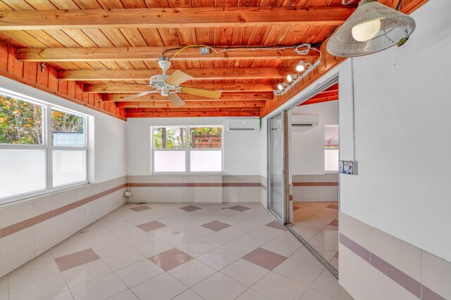 140 Gardenia St, Tavernier, FL 33070 - unfurnished sunroom featuring a wall unit AC and beam ceiling