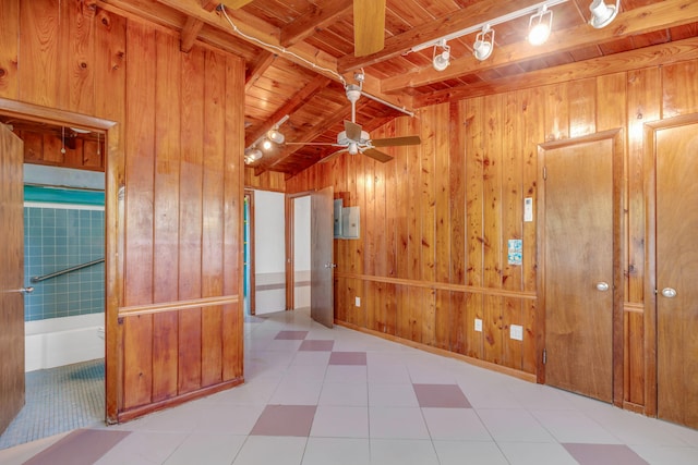140 Gardenia St, Tavernier, FL 33070 - empty room with wood ceiling, wood walls, rail lighting, and ceiling fan