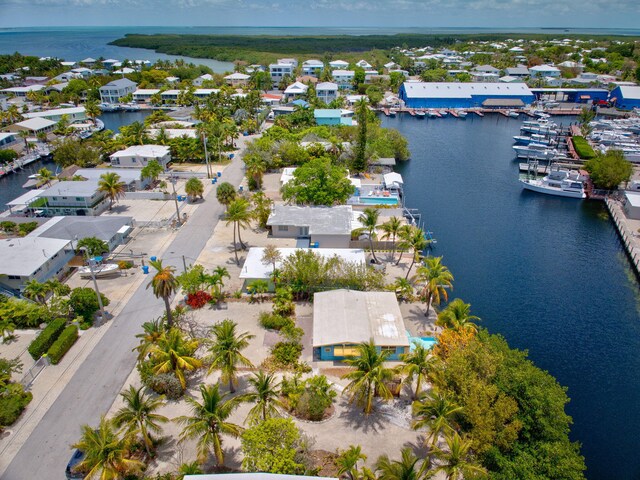 140 Gardenia St, Tavernier, FL 33070 - aerial view of residential area featuring a nearby body of water