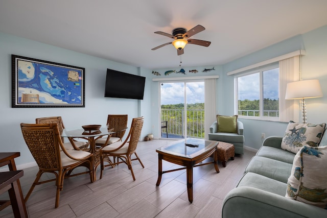 living room featuring light hardwood / wood-style floors and ceiling fan